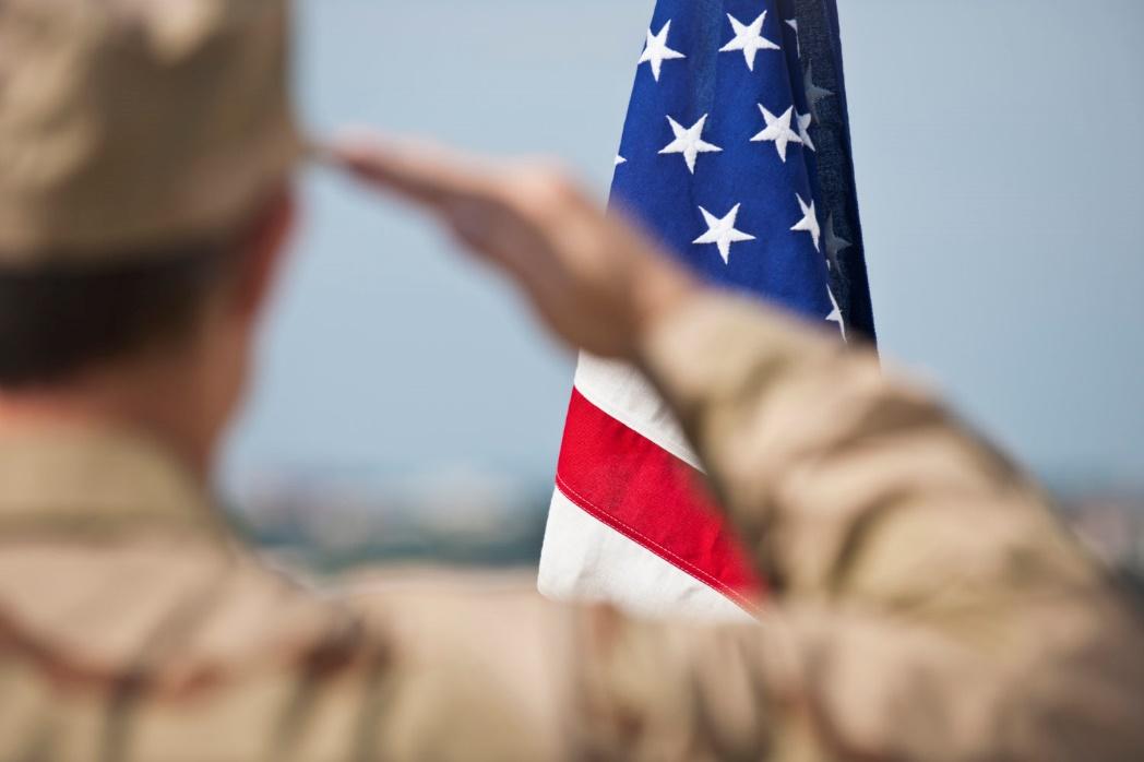 Man saluting American flag